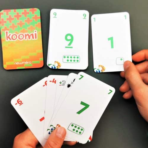 Koomi card game in hand square scaled